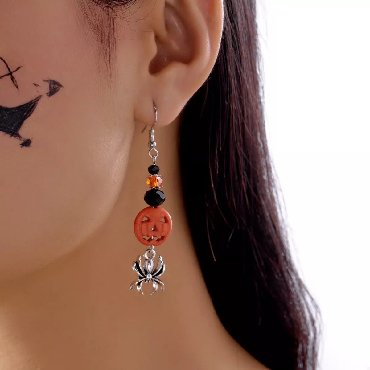 Halloween spider pumpkin drop earrings by Trendsi featuring Halloween-themed pumpkin and spider charms on dangle earrings