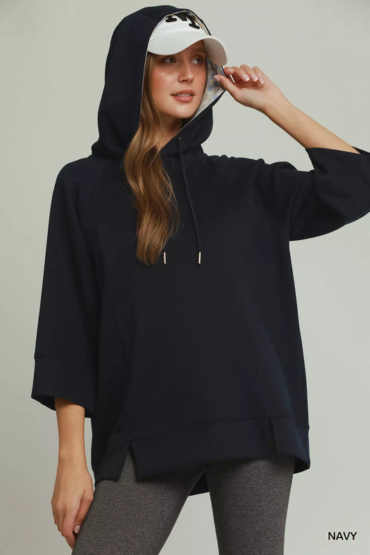 Umgee 3/4 sleeve tunic top with graphic hoodie, featuring casual style and comfortable fabric, in a trendy women's fashion design.