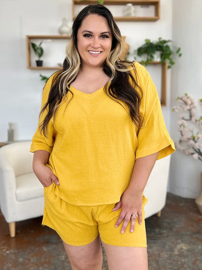 Trendsi double take textured half sleeve T-shirt and drawstring shorts set on a model, showcasing casual comfort and stylish design.