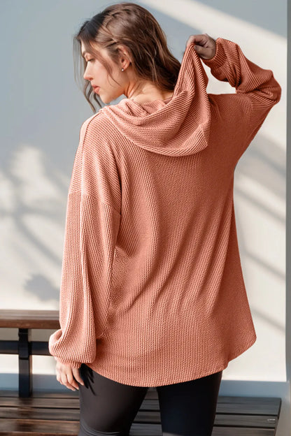 Long sleeve hoodie with half button front in a full size, featuring a double take design by Trendsi, shown in a close-up image.