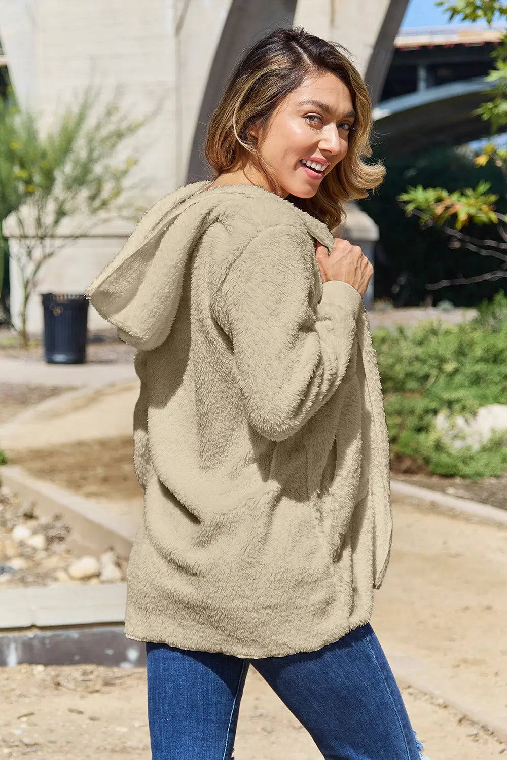 Full size Teddy hooded jacket with pockets from Trendsi, featuring a cozy textured fleece material and a hood for warmth.