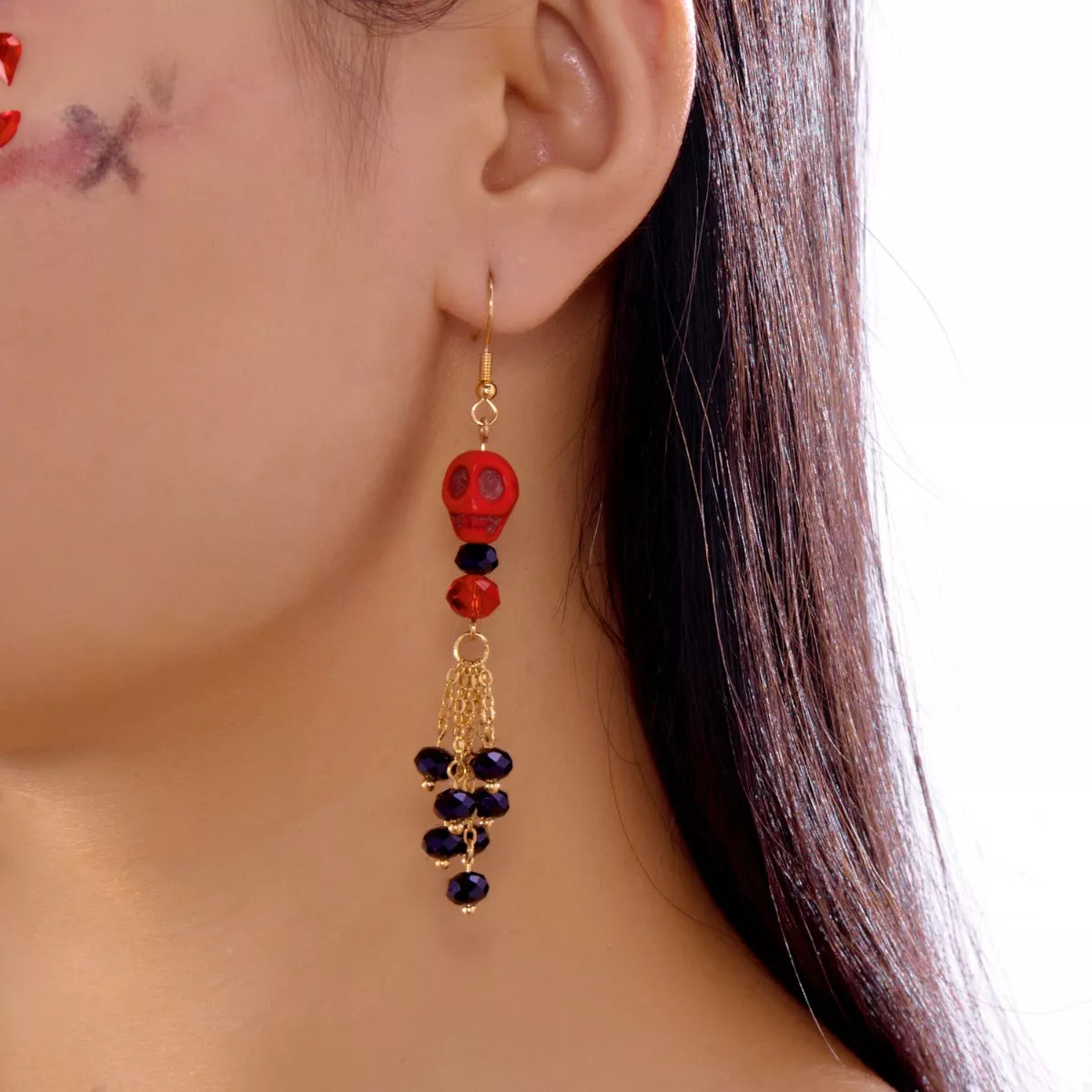 Halloween Skull Beaded Drop Earrings featuring black beads and skull charms, stylishly hanging from silver hooks.