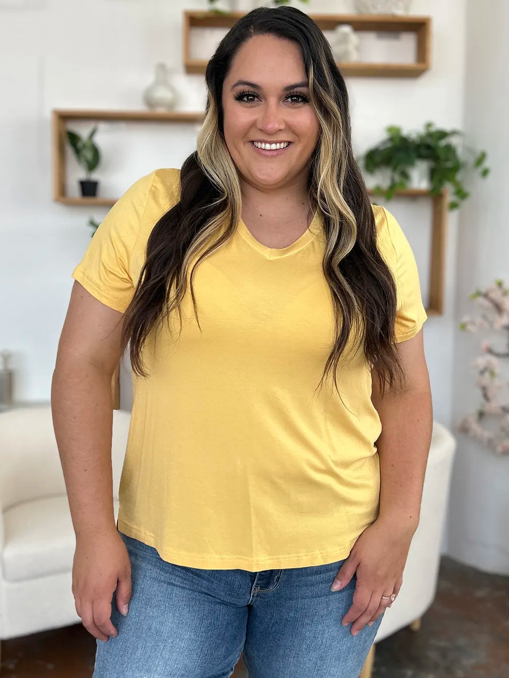 Basic Bae Bamboo full-size V-neck high-low T-shirt by Trendsi, featuring soft bamboo fabric, V-neck style, and relaxed fit.