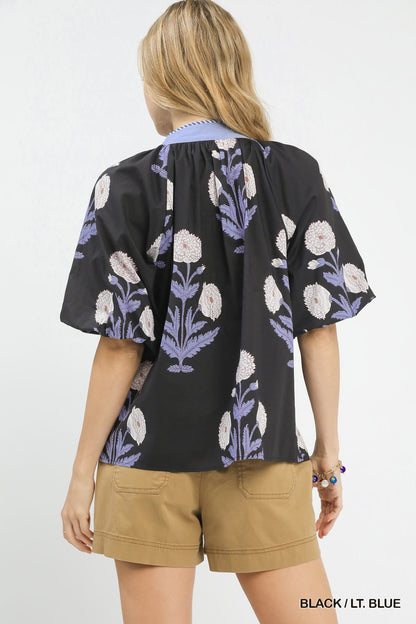 Umgee floral print v-neck top by Trendsi featuring a lightweight fabric and vibrant blossom pattern on a casual women's blouse.