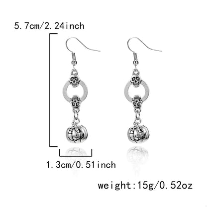 Halloween Pumpkin Dangle Earrings by Trendsi featuring orange pumpkin charms hanging from silver hooks