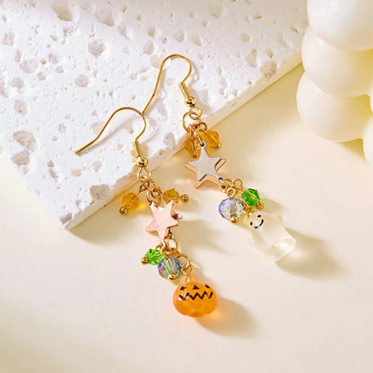 Halloween asymmetrical pumpkin and ghost earrings by Trendsi featuring festive orange pumpkins and spooky ghost charms.