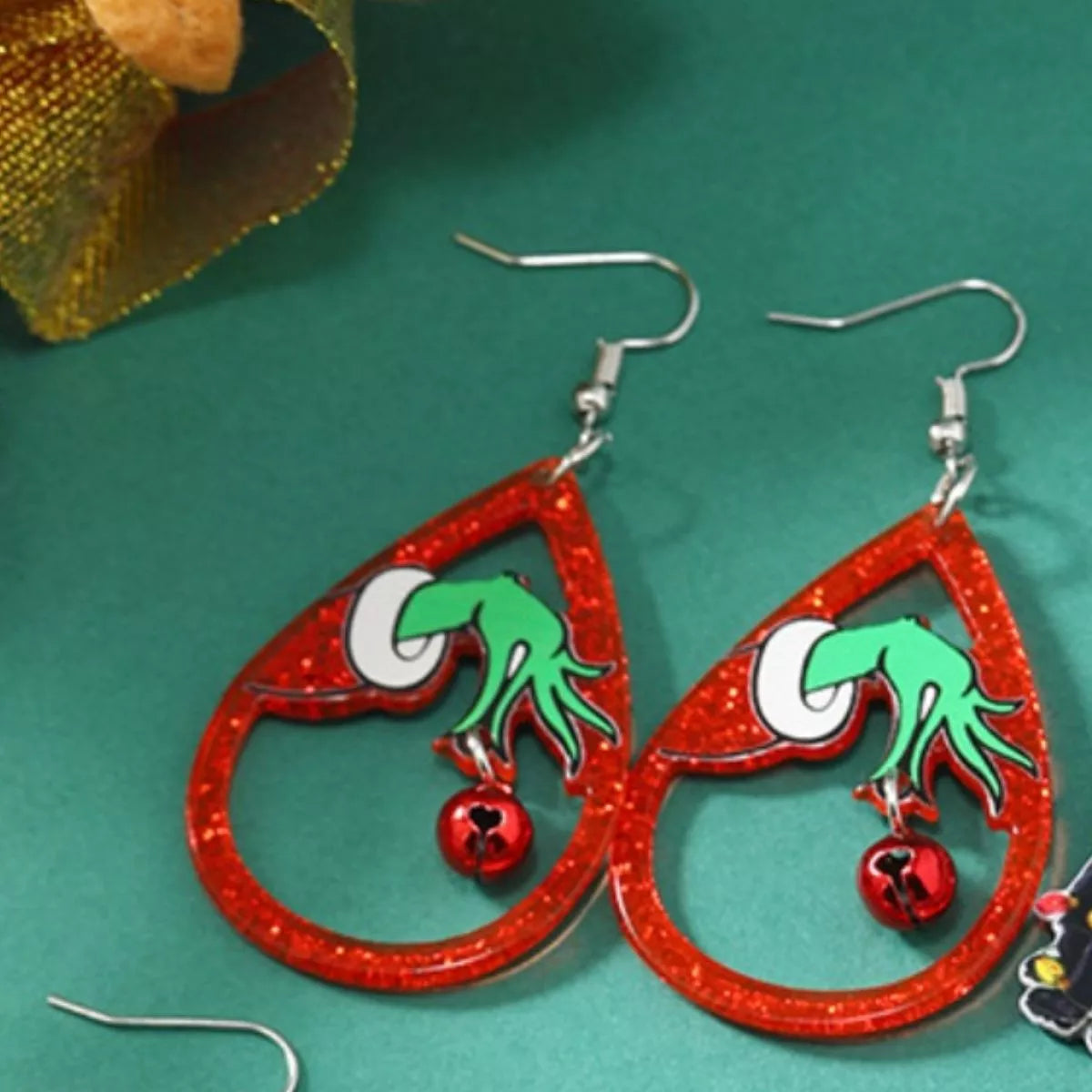 Halloween teardrop earrings by Trendsi featuring spooky ghost and pumpkin designs on silver hooks.