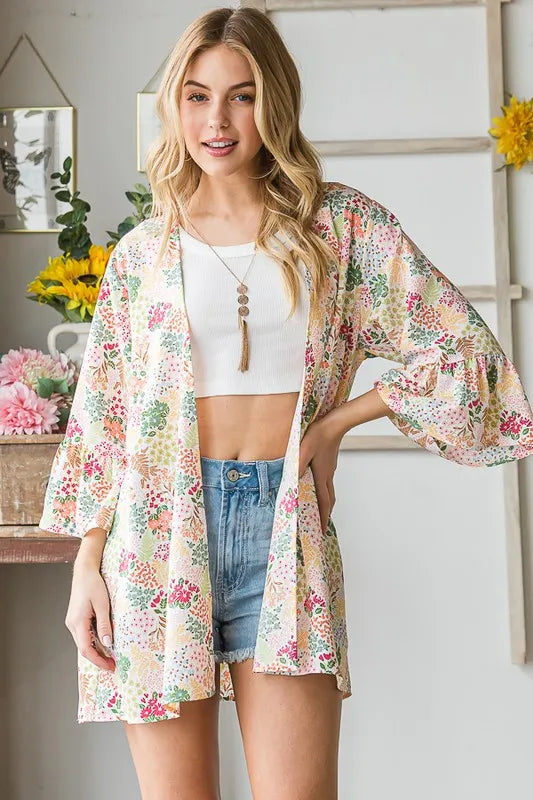 Plus size Heimish floral open cardigan from Trendsi in multiple colors, featuring a full-size, lightweight knit with vibrant flower patterns.