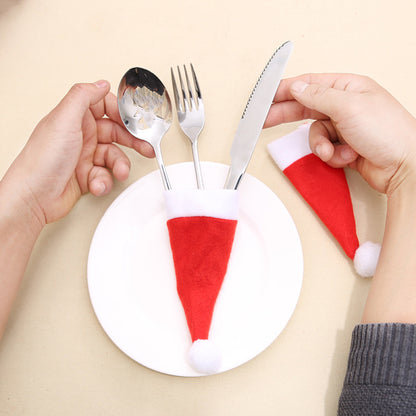 Set of 20 Christmas hat-shaped cutlery holders featuring festive red and green designs, perfect for holiday table settings.