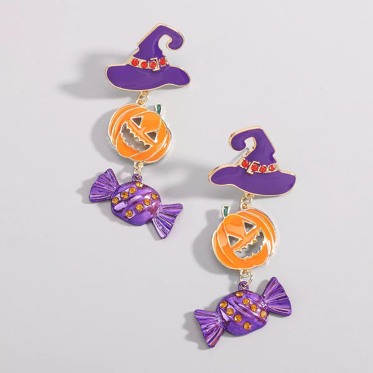 Halloween pumpkin earrings made of 18K gold-plated alloy, featuring festive pumpkin-shaped dangles with autumn-inspired details.