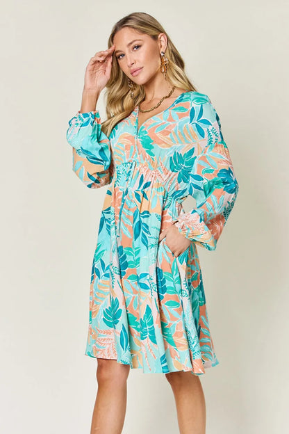 Printed V-neck drawstring dress by Trendsi, full size, featuring a stylish pattern and comfortable fit.