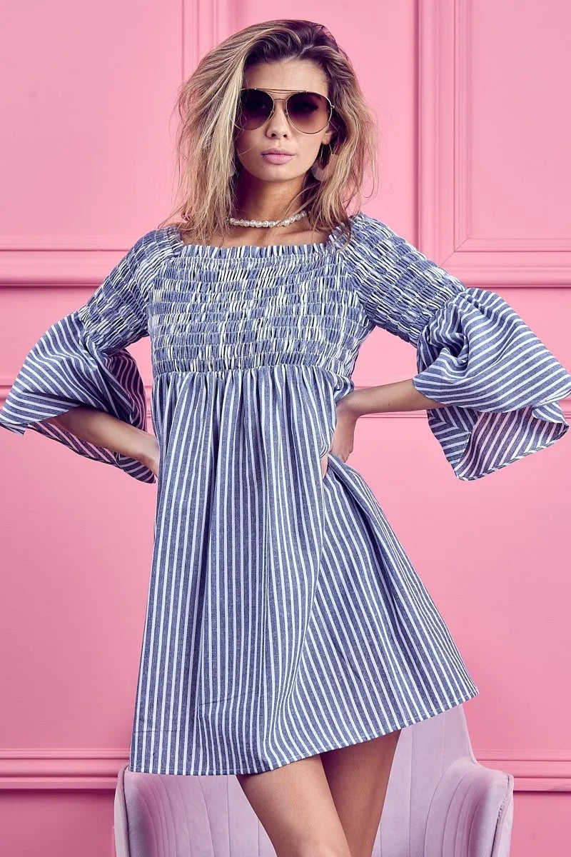 Blue and white striped BiBi Smocked Off Shoulder Dress by Trendsi, featuring a fitted bodice and ruffled off-shoulder neckline.