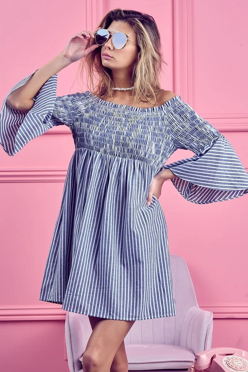 Blue and white striped BiBi smocked off-shoulder dress by Trendsi, featuring a fitted bodice and flowing fabric.