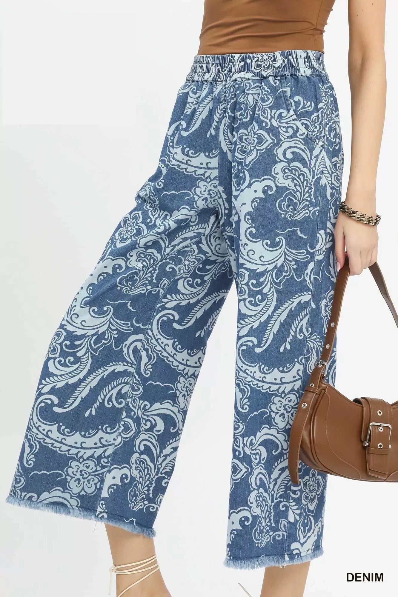 Stone wash wide-leg crop pants by Umgee featuring a relaxed denim style and cropped length, perfect for casual wear.
