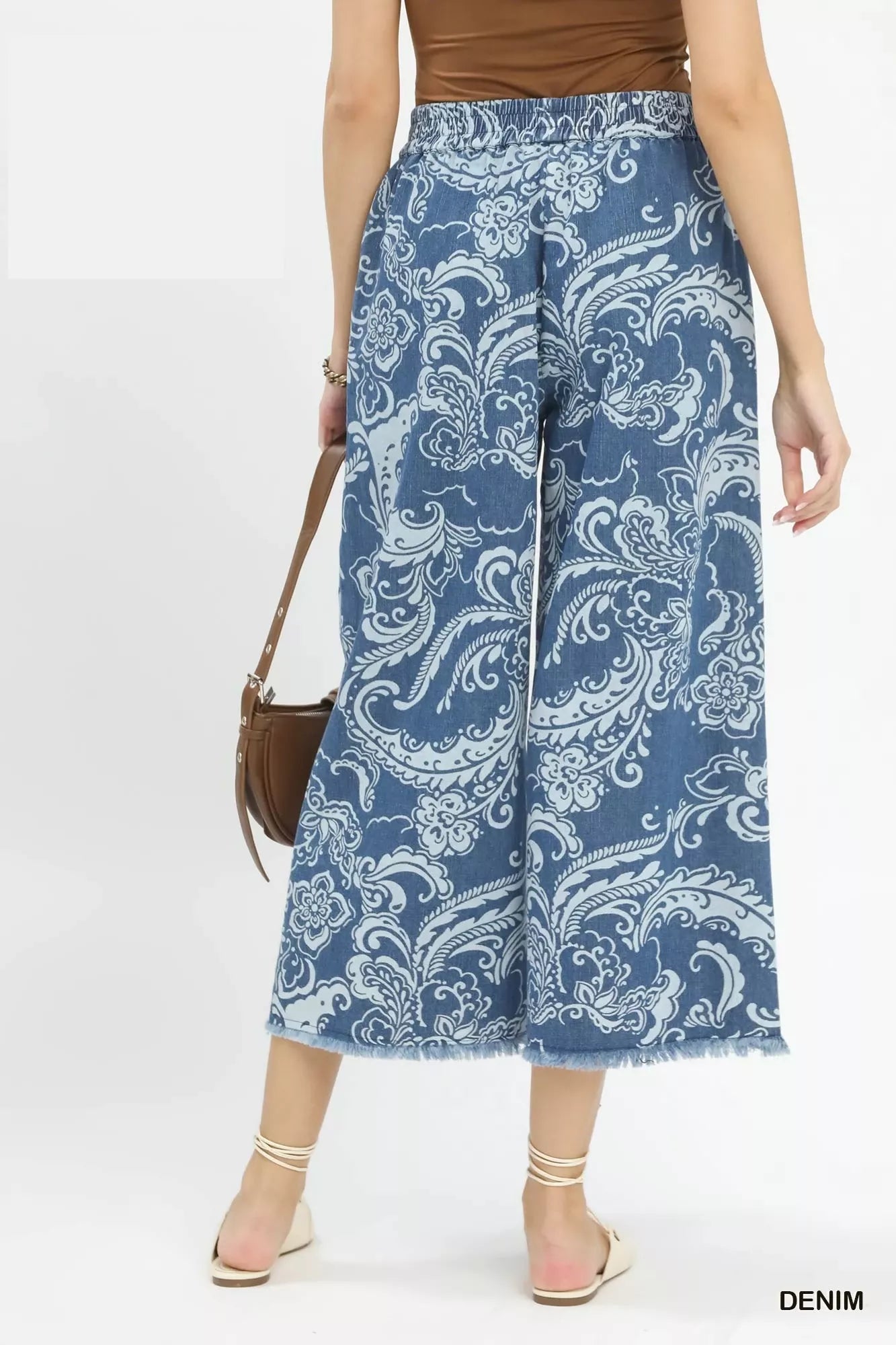 Stone wash wide-leg crop jeans from Umgee, stylish denim pants with relaxed fit and cropped length.