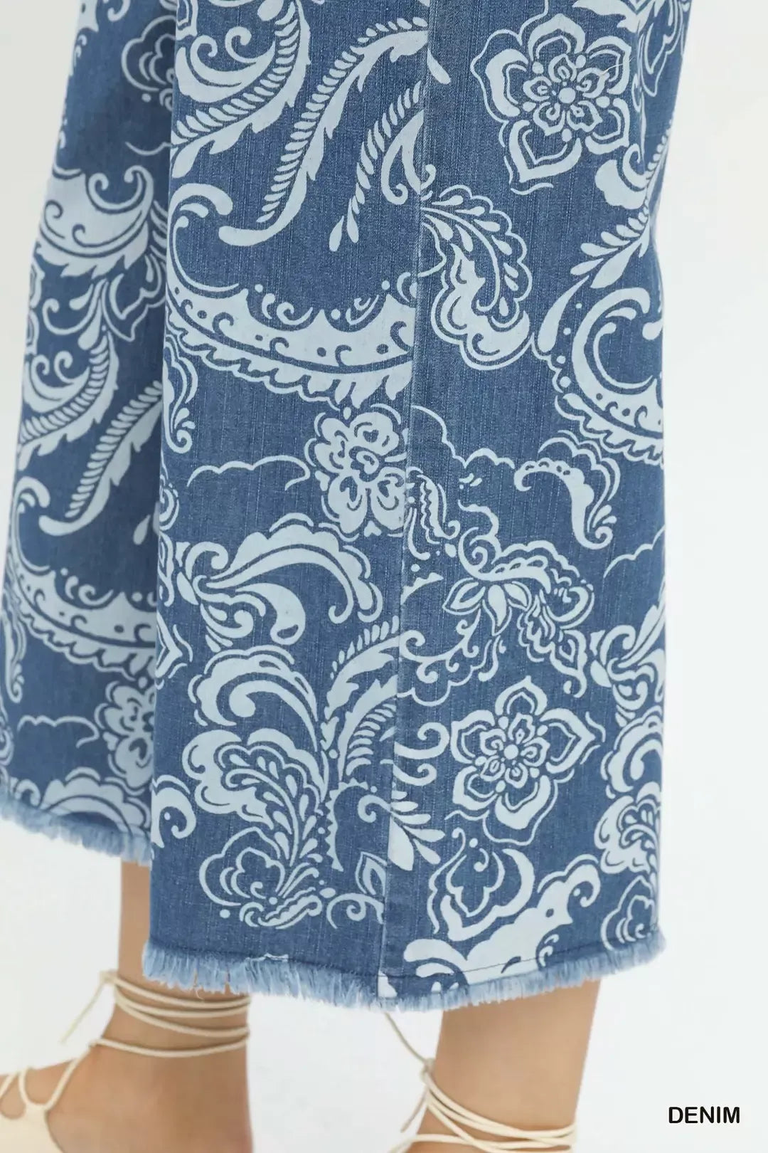 Stone wash wide leg crop pants by Umgee featuring denim fabric, relaxed fit, and trendy style.