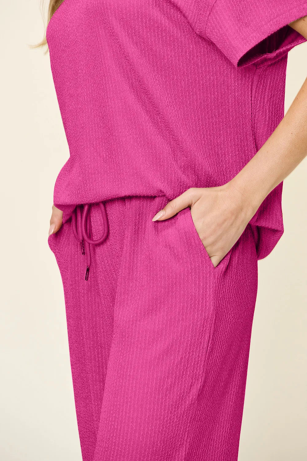 Trendsi double take full size textured round neck short sleeve t-shirt with wide leg pants, casual outfit, front view.