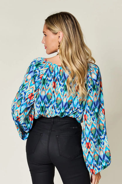 Printed balloon sleeve blouse from Trendsi featuring a double take full size design with vibrant print and stylish balloon sleeves.
