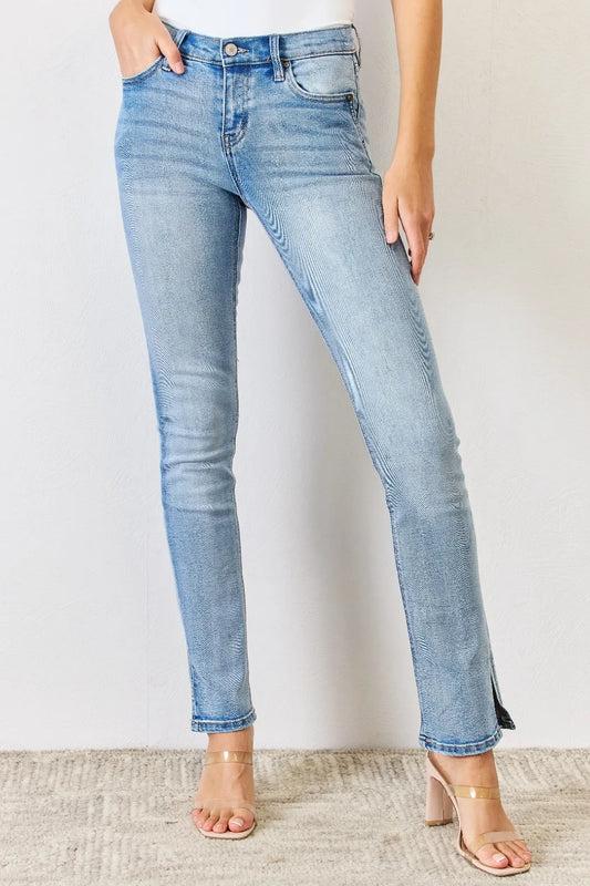 Kancan mid-rise Y2K slit bootcut jeans from Trendsi, featuring a full size fit, retro style, and classic bootcut leg.
