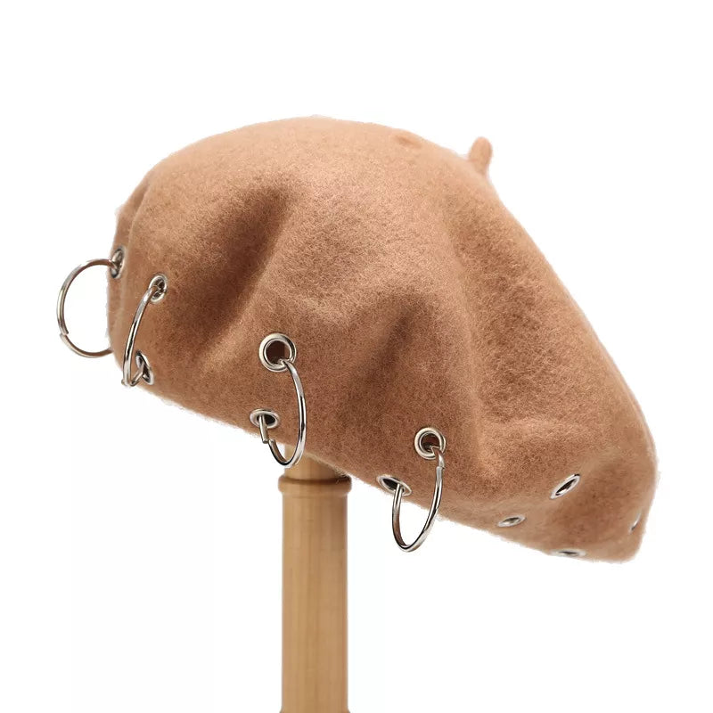 Metal ring embellished beret hat from Trendsi featuring a classic black design and stylish metallic accents.