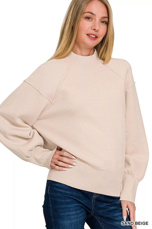 Viscose mock neck sweater with exposed seams by Trendsi, featuring a stylish, fitted design and textured fabric.