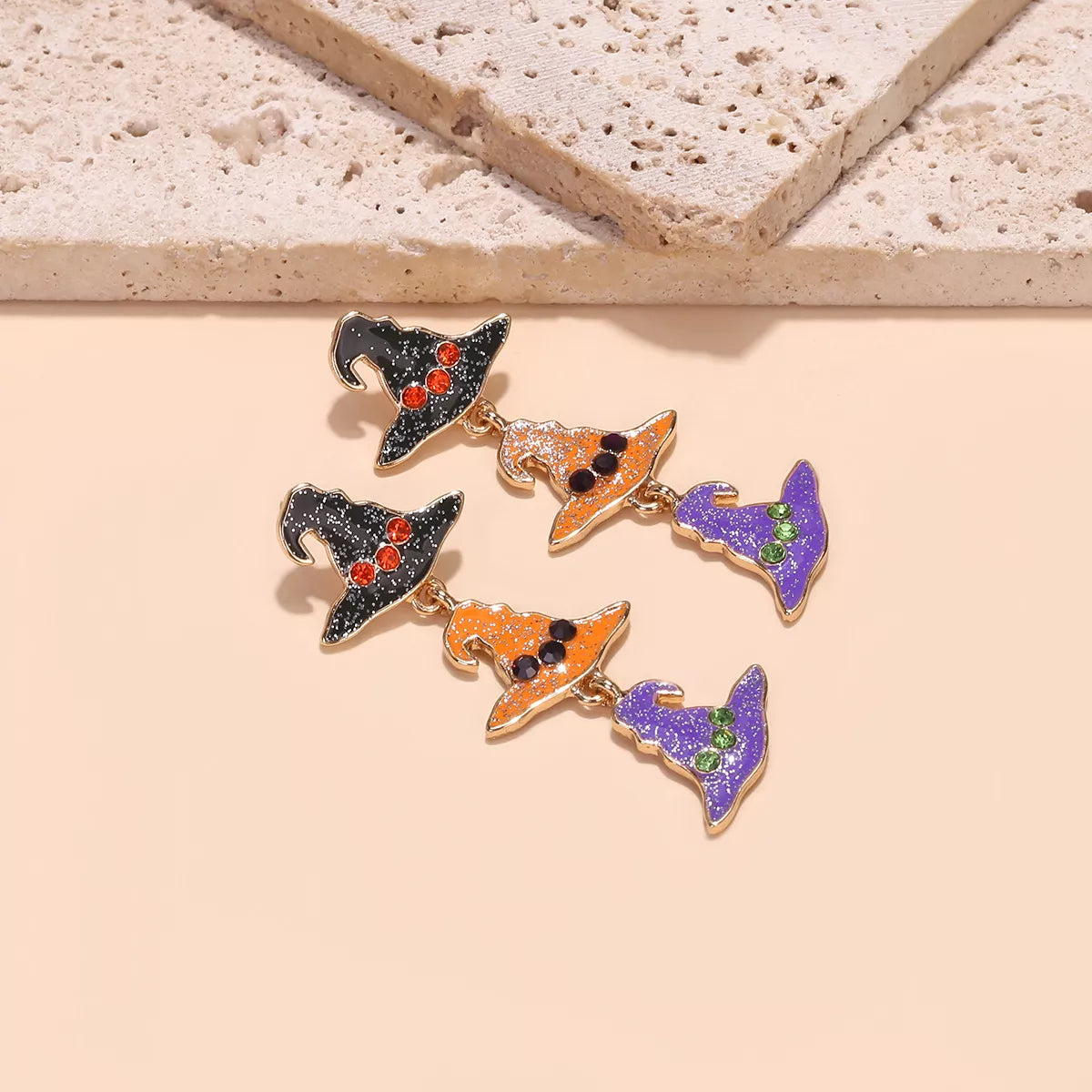Halloween witch hat drop earrings featuring black witch hat charms, perfect for spooky seasonal jewelry by Trendsi.