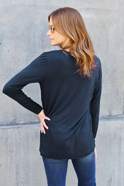 Basic Bae full size round neck long sleeve top by Trendsi, shown in a soft fabric with a classic fit and long sleeves.