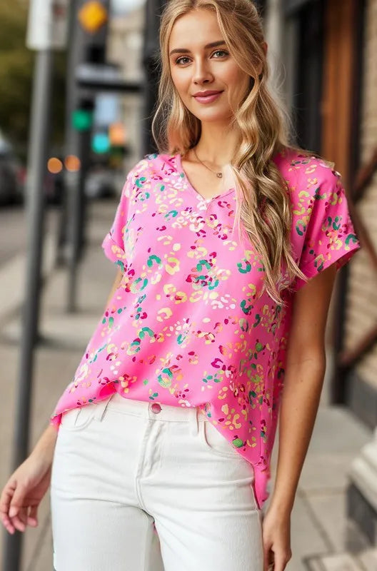 Heimish full size animal print V-neck short sleeve T-shirt in plus size, featuring a bold animal pattern and comfortable fit.