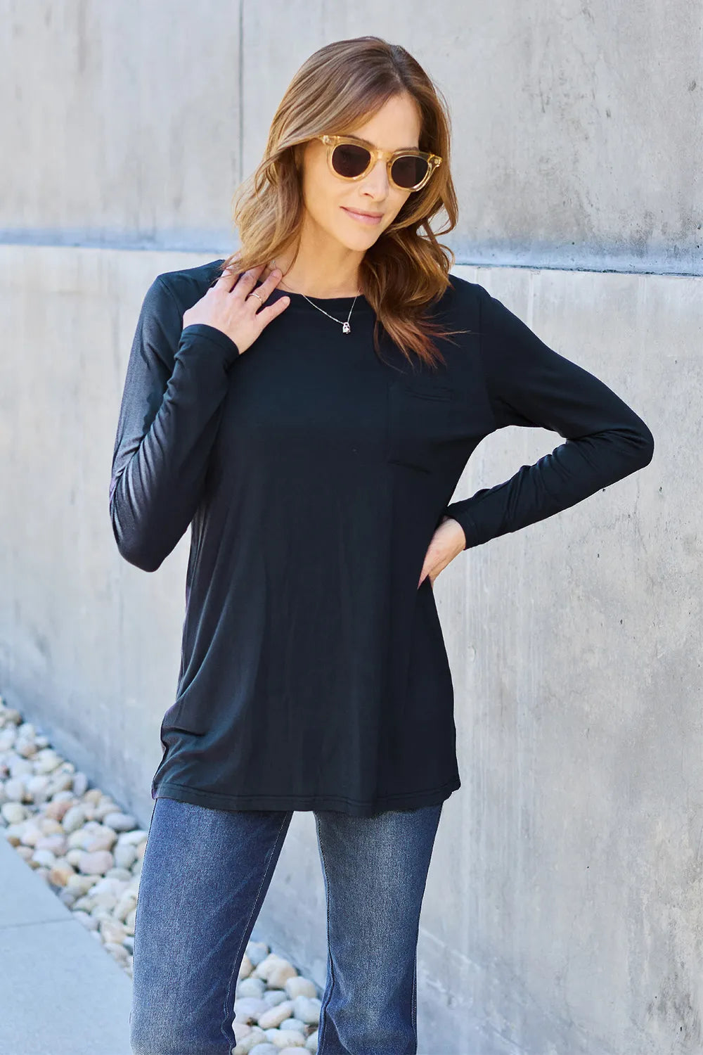 Basic Bae full size round neck long sleeve top by Trendsi, shown in black, featuring a classic fit and soft fabric.