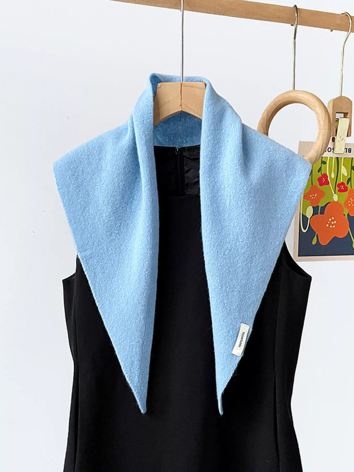 Solid color knit scarf from Trendsi in soft fabric, showcasing a cozy, versatile accessory with a smooth, seamless texture.