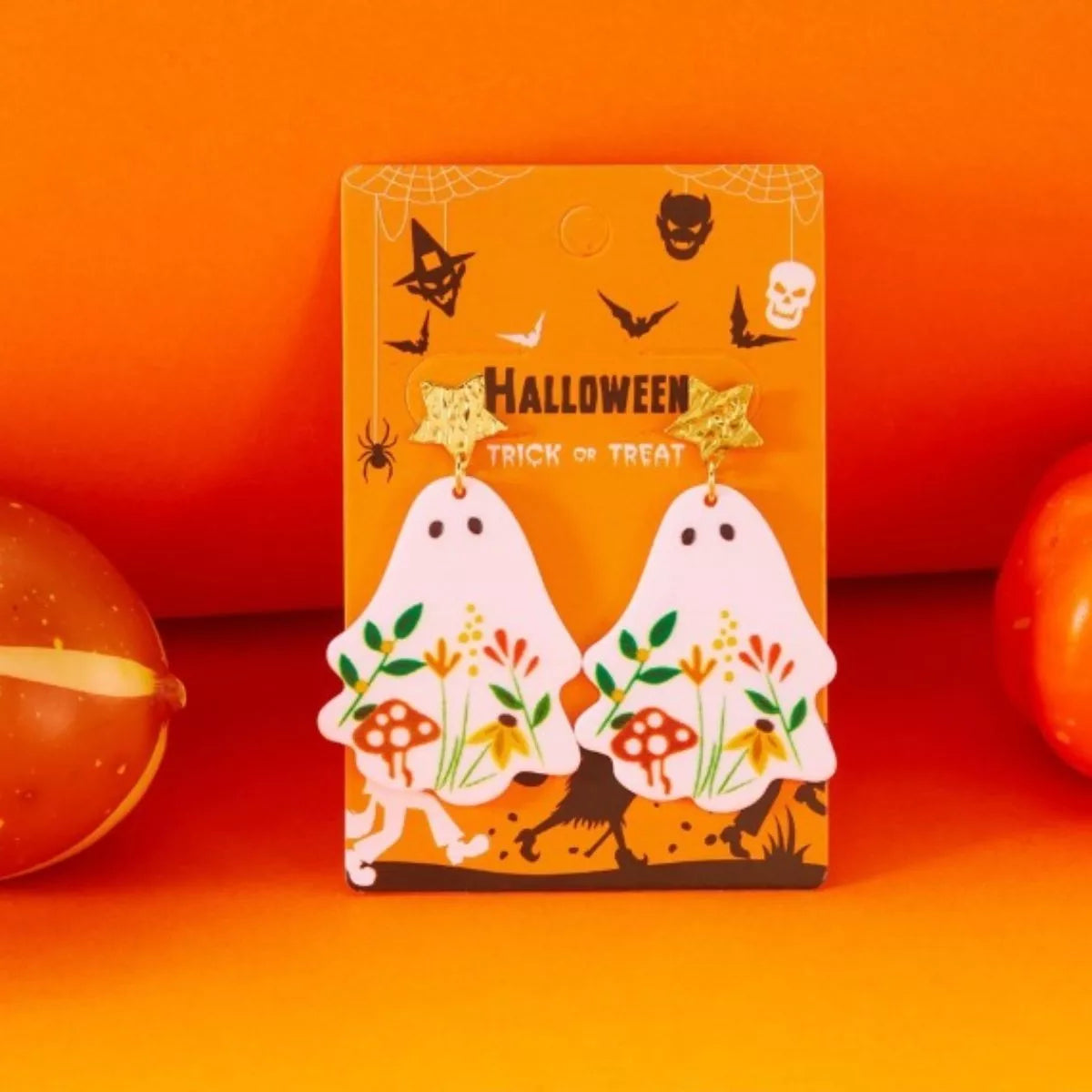 Whimsical ghost earrings with floral design, trendy jewelry featuring playful ghost shapes and colorful flower accents.