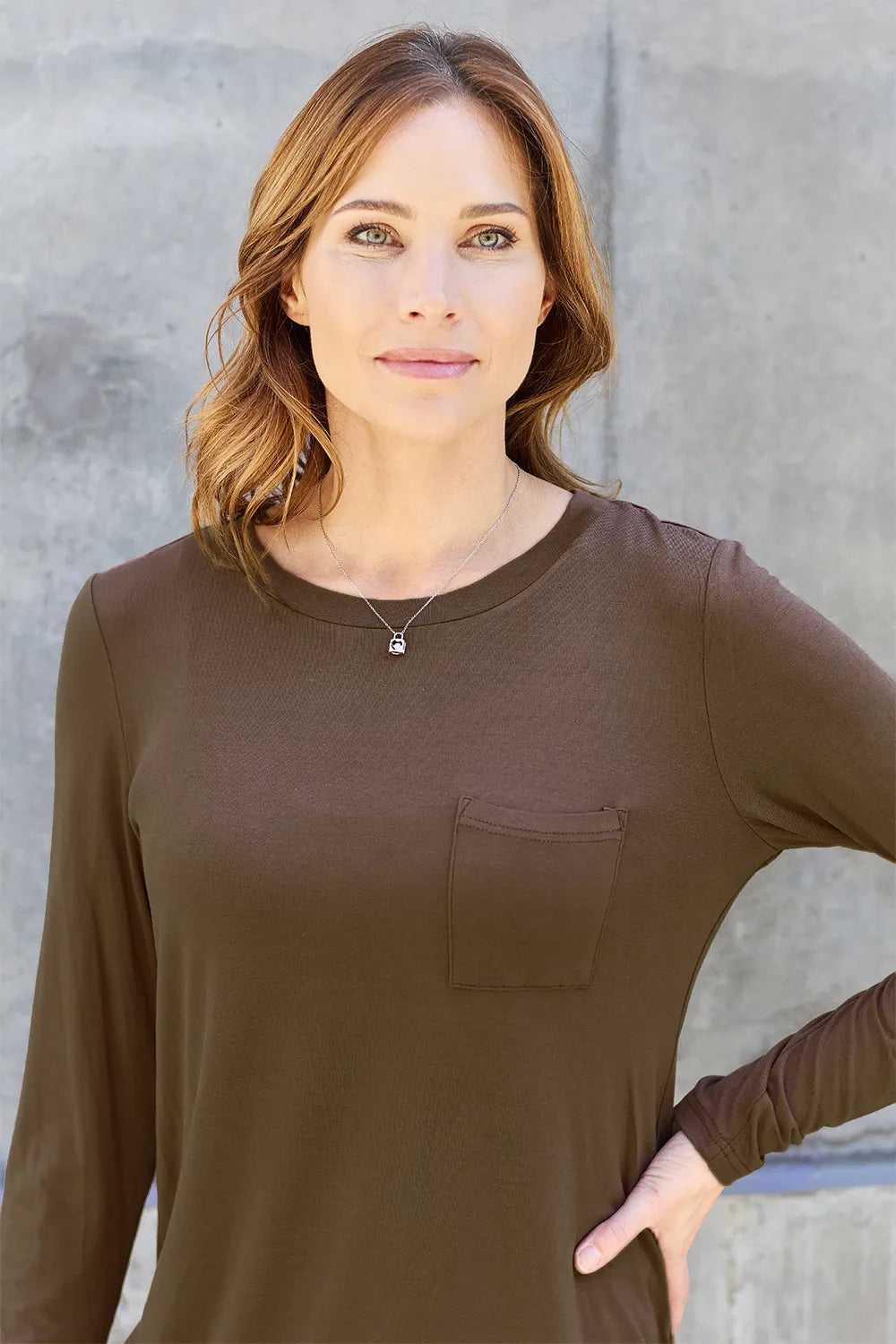 Basic Bae full size round neck long sleeve top by Trendsi, shown in black with soft fabric and classic fit.