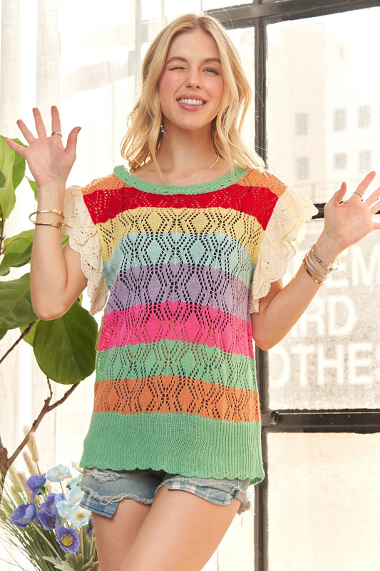 Multi-color crochet top with eyelet sleeves from Trendsi's ADORA collection, featuring a stylish and breathable design.