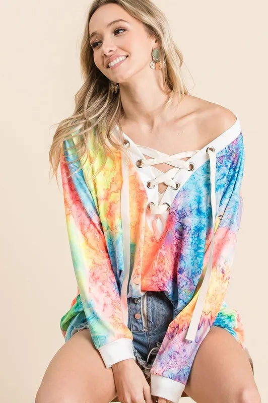 BiBi Tie Dye Deep V-neck top by Trendsi featuring a lace-up front and vibrant tie dye pattern.