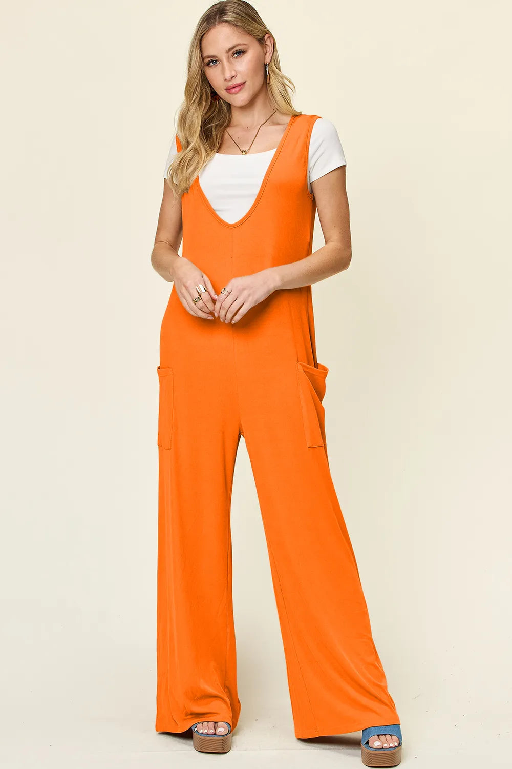 Plus size Trendsi double take sleeveless wide-leg jumpsuit with pockets, full length, casual style, and comfortable fit.