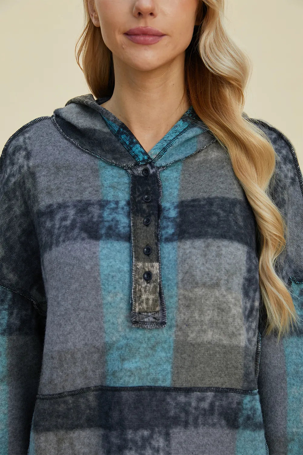 Plus size plaid fleece hoodie with dropped shoulders, cozy and stylish, from Trendsi's Double Take collection.