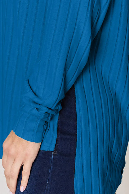Basic Bae full size ribbed round neck slit T-shirt by Trendsi, featuring a ribbed fabric and relaxed fit in a casual style.