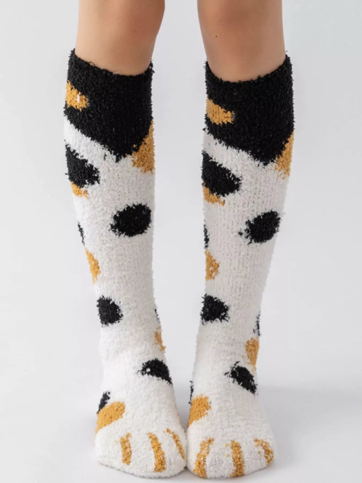 Fuzzy knee-high animal paw socks from Trendsi featuring soft, cozy fabric with paw print design, perfect for warm, playful style