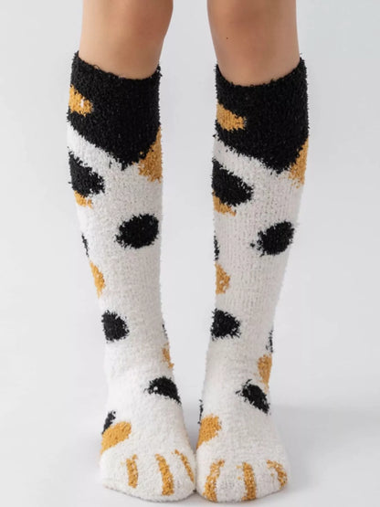Fuzzy knee-high animal paw socks from Trendsi featuring soft, cozy fabric with paw print design, perfect for warm, playful style