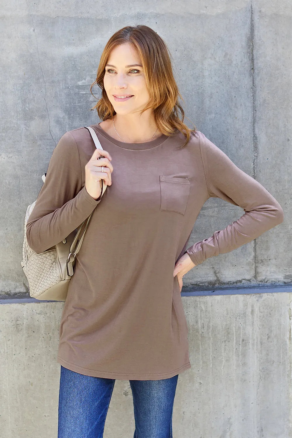 Basic Bae full-size round neck long sleeve top by Trendsi, shown in a neutral color, featuring a classic fit and simple design.