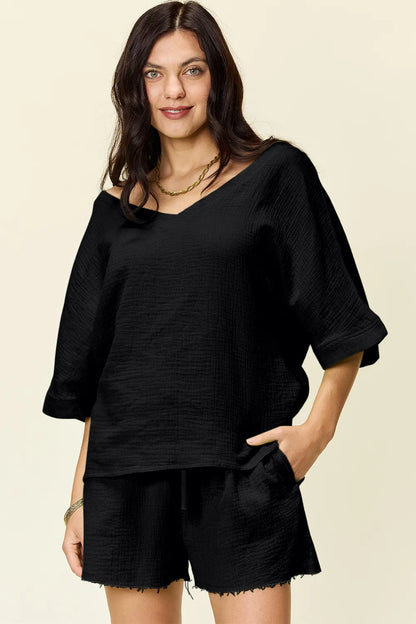 Trendsi Double Take Texture half sleeve T-shirt and drawstring shorts set, featuring a textured fabric and casual fit.