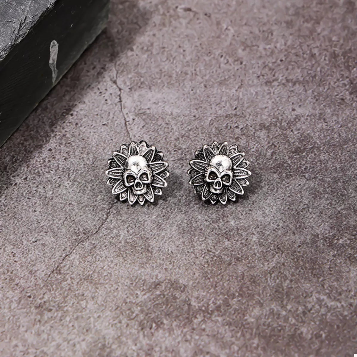 Halloween Skull Sunflower Stud Earrings by Trendsi, featuring skull and sunflower designs in gold-tone metal, close-up view.