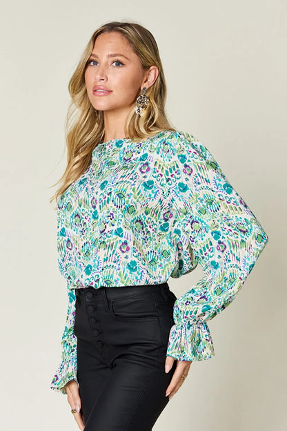 Printed flounce sleeve blouse from Trendsi featuring a double take full size design with bold patterns and flowing fabric.