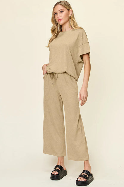 Trendsi Double Take full size texture round neck short sleeve T-shirt with wide-leg pants, showcasing a casual, stylish outfit.