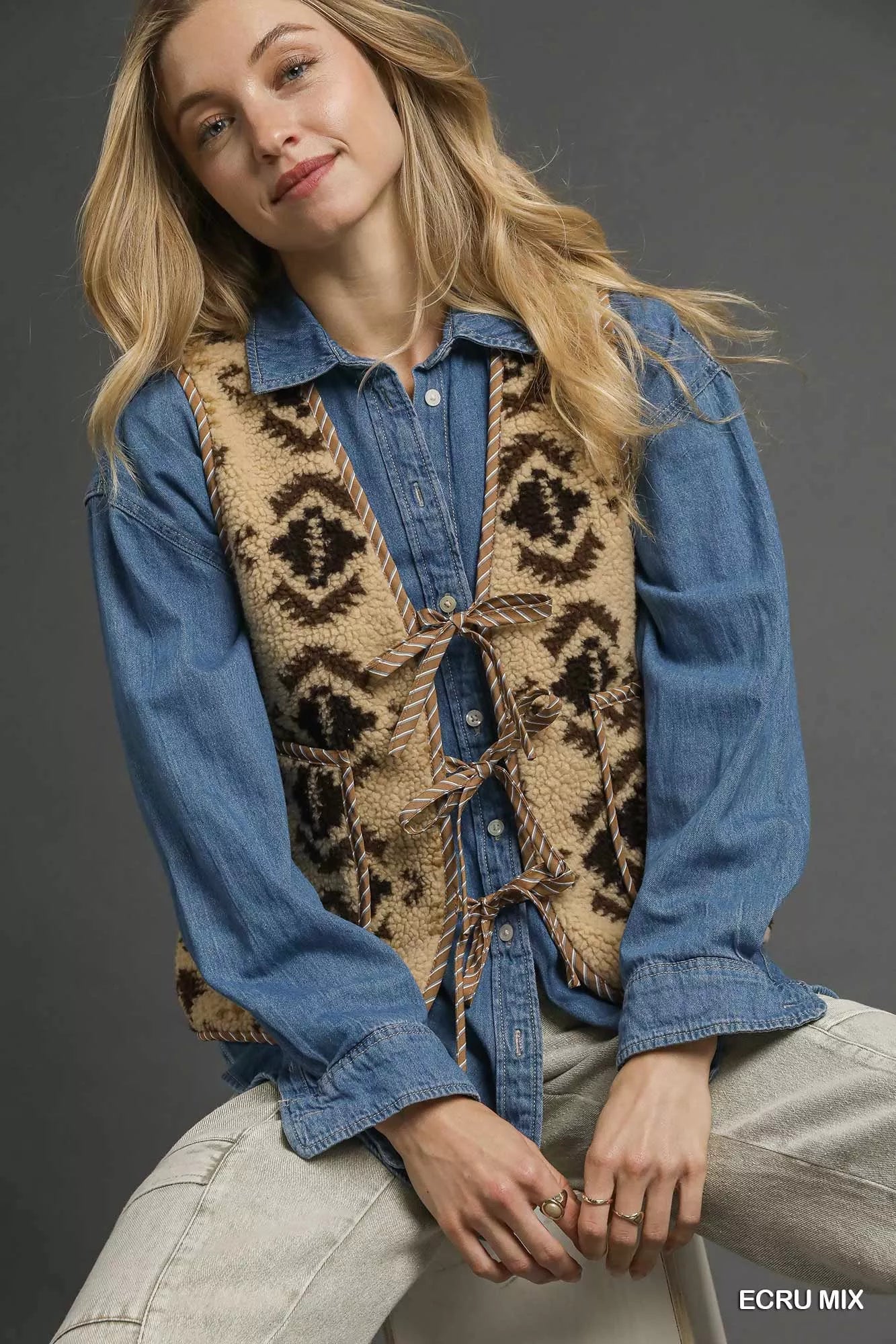 Ecru mixed pattern Sherpa tie-front vest by Umgee, featuring soft textured fabric and stylish design, ideal for layered outfits.