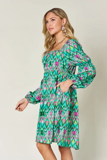 Printed long sleeve dress from Trendsi's Double Take collection, full size, featuring a stylish design and comfortable fit.