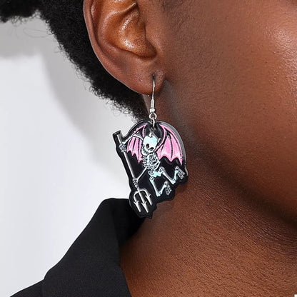 Spooky skeleton devil wing dangle earrings with Halloween-themed design, featuring skeleton and devil wing details.