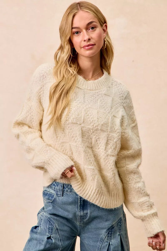 Trendsi BiBi Checker Board Drop Shoulder Sweater with a cozy, oversized fit and bold checkered pattern, displayed on a model.