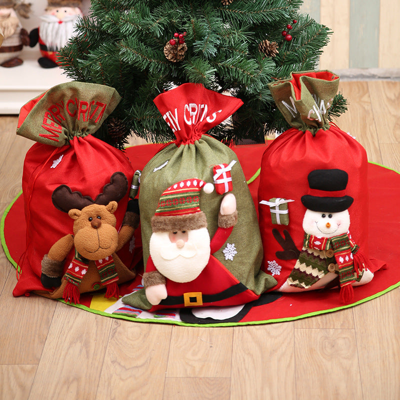 Red drawstring Christmas gift bag from Trendsi with festive holiday design, perfect for wrapping presents during the holiday season.