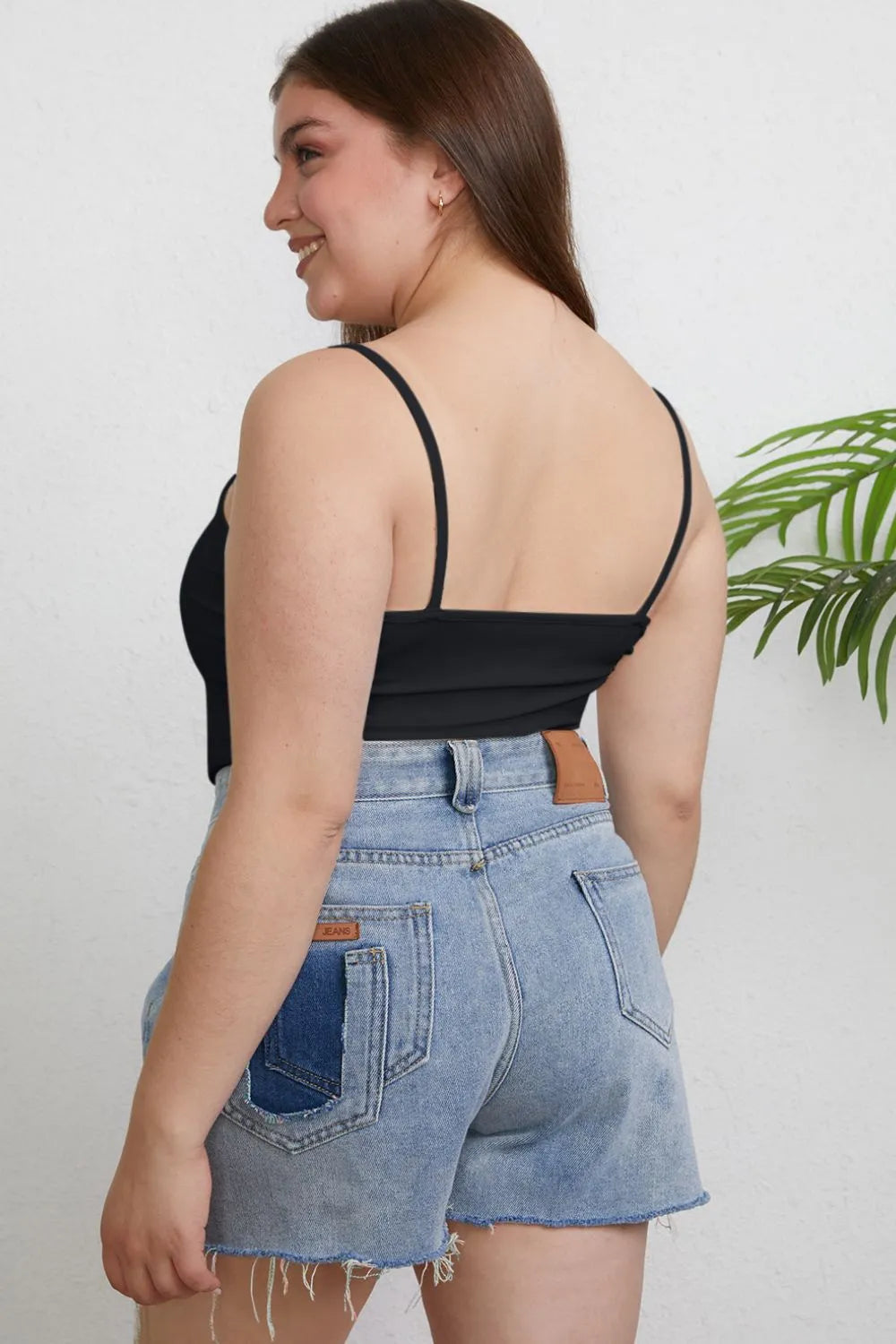 Plus size Basic Bae full-size round neck slim cami by Trendsi, featuring a close-up of the soft, fitted fabric and neckline.
